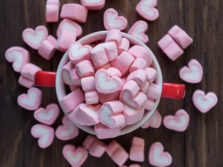 Heart-shaped pink marshmallows in a bowl