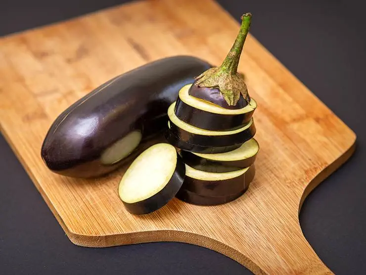 Sliced eggplant on a wooden board