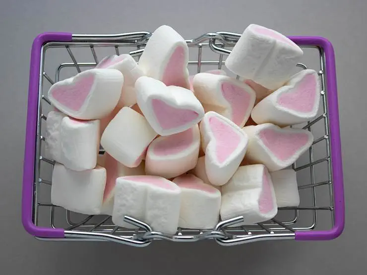 A basket full of heart-shaped marshmallows